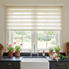Linen-blend zebra blind with alternating sheer bands in a bright kitchen window