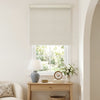 Light beige jacquard blackout roller blind with woven texture over window