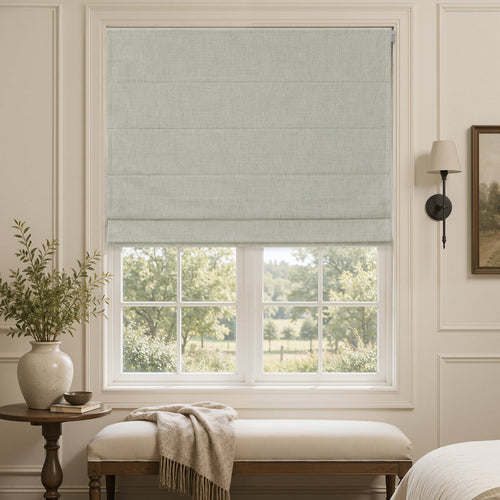 Alder linen look blackout Roman blind in light gray on a white window frame